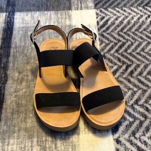 by the way. Kids Sandals with Black Straps and Tan Base